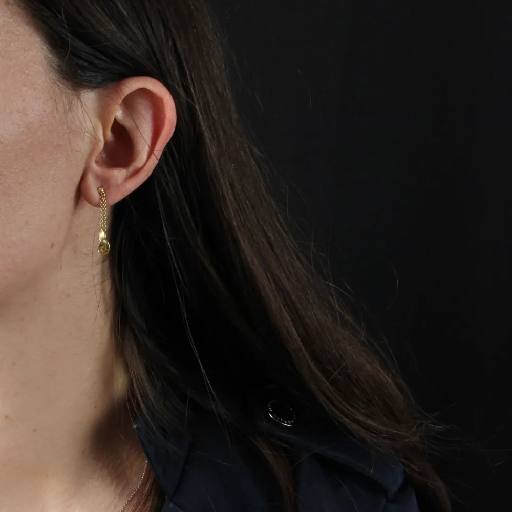 Gold petal dangling earrings
