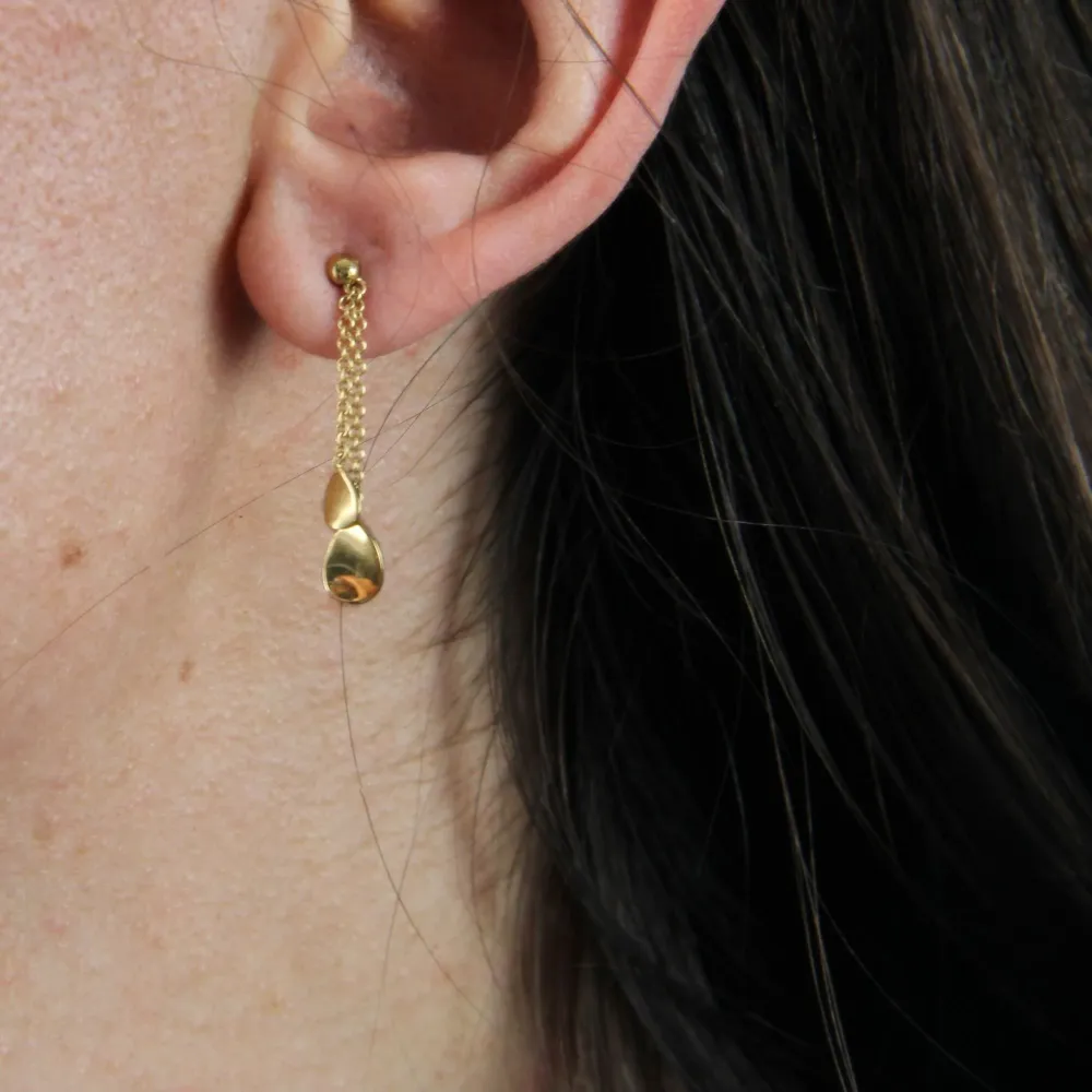 Gold petal dangling earrings