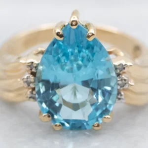 Pear Cut Blue Topaz and Diamond Ring