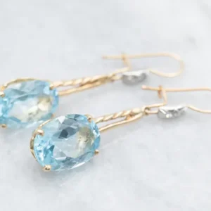 Twisting Blauw Topaz and Diamond Drop Earrings