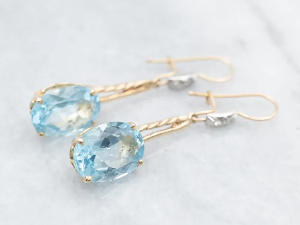 Twisting Zeeblauw Topaz and Diamond Drop Earrings