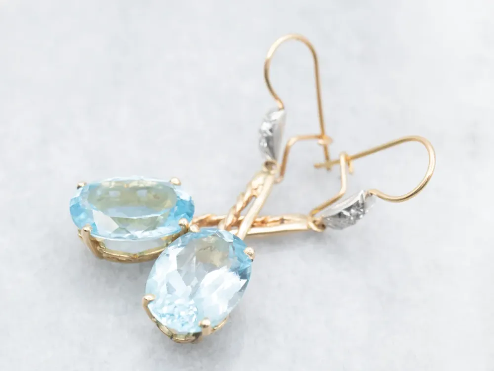 Twisting Zeeblauw Topaz and Diamond Drop Earrings