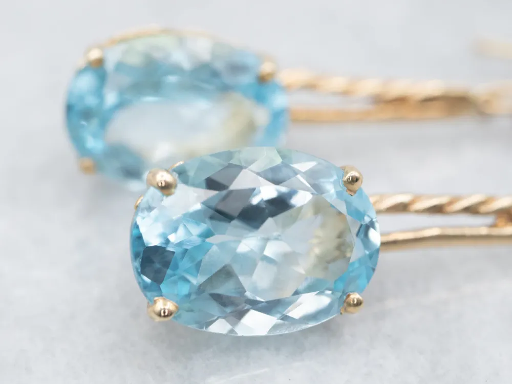 Twisting Zeeblauw Topaz and Diamond Drop Earrings