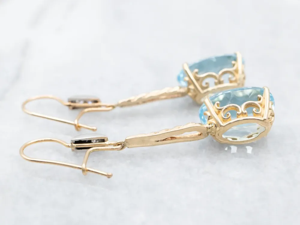 Twisting Zeeblauw Topaz and Diamond Drop Earrings