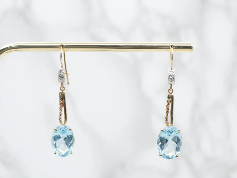 Twisting Zeeblauw Topaz and Diamond Drop Earrings
