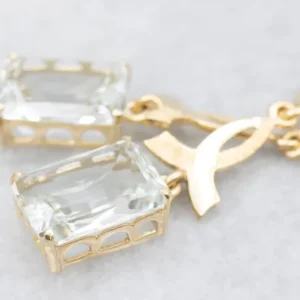 Zeeblauw Topaz and Gold Cancer Awareness Drop Earrings