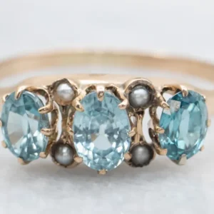 Zeeblauw Zircon and Seed Pearl Antique Rose Gold Ring
