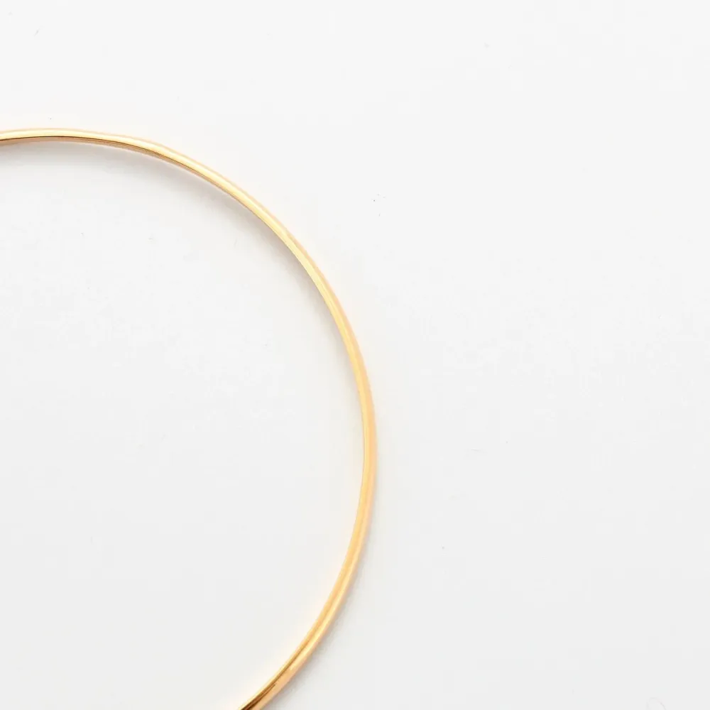 Yellow gold curved half bangle bracelet