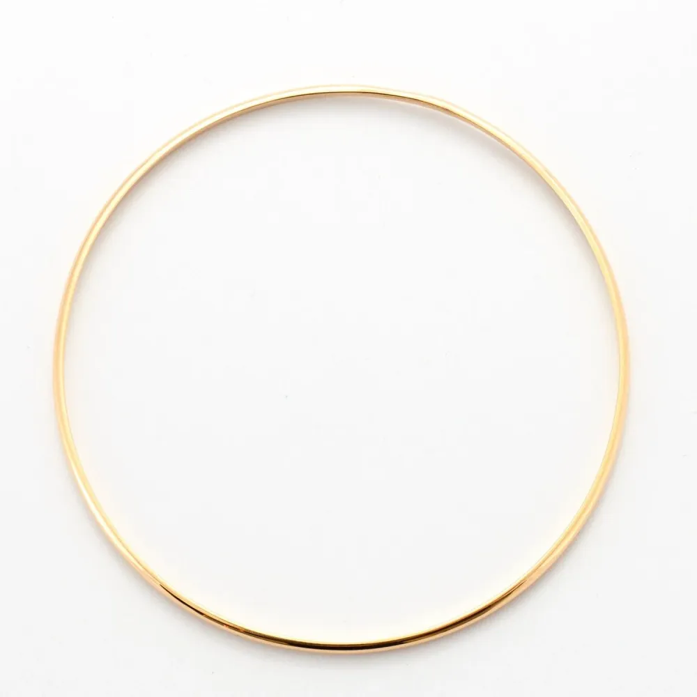 Yellow gold curved half bangle bracelet