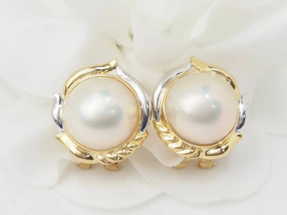 Important earrings dubbele kleur gold and half pearls