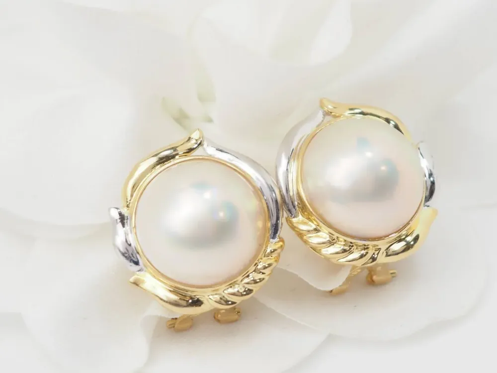 Important earrings dubbele kleur gold and half pearls