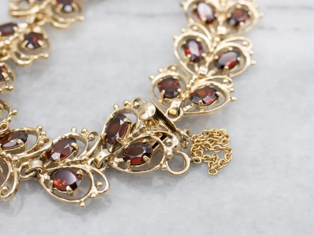 Looping Goud and Garnet Butterfly Link Bracelet