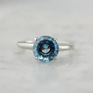 October Sky Engagement: Brilliant Round Zeeblauw Topaz Solitaire Ring