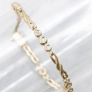 Twisting Gold Bezel Set Diamond Link Bracelet
