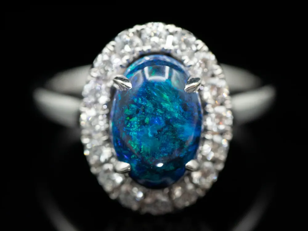 18K Wit Gold Black Opal Oval and Diamond Halo Ring