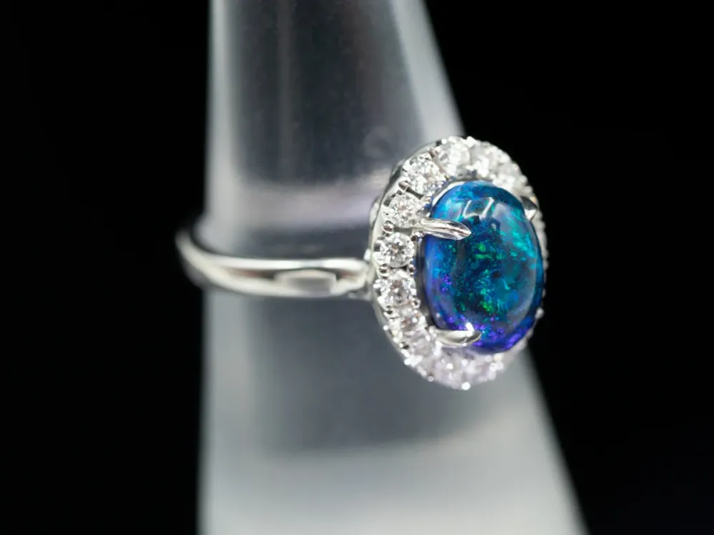 18K Wit Gold Black Opal Oval and Diamond Halo Ring