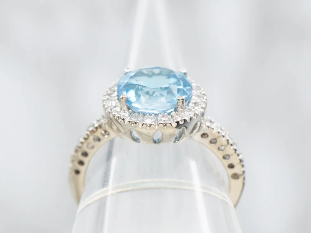 Modern White Gold Blue Topaz and Diamond Halo Ring
