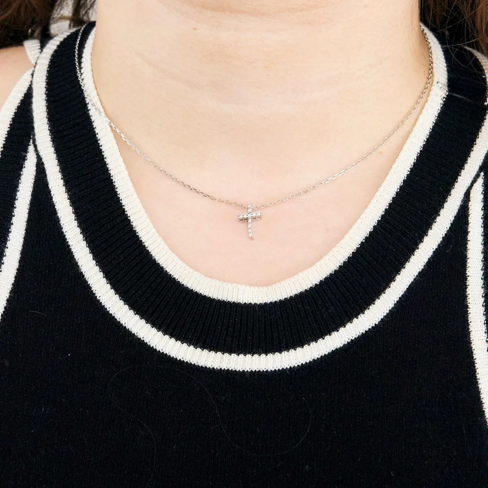 White gold and diamond cross pendant and chain