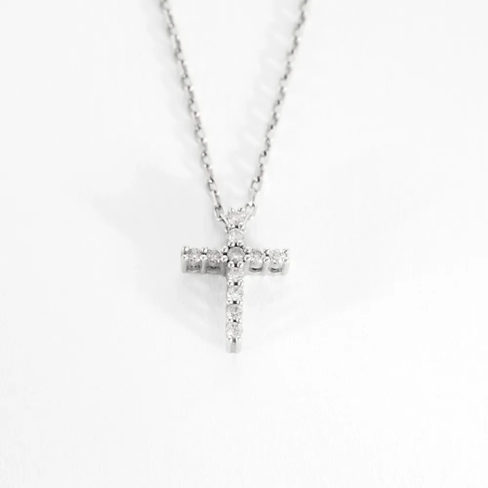 White gold and diamond cross pendant and chain