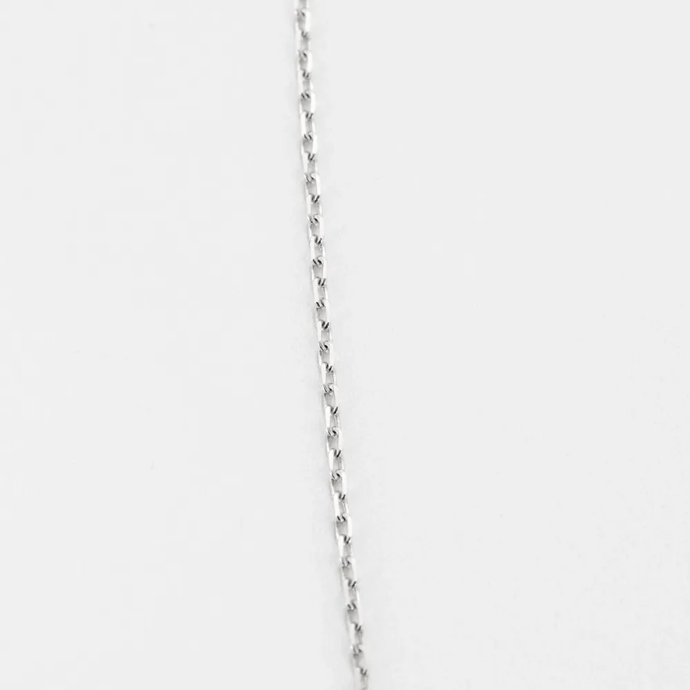 White gold and diamond cross pendant and chain